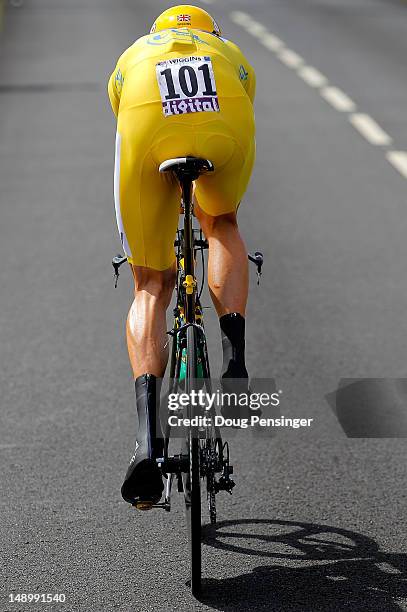 Bradley Wiggins of Great Britain riding for Sky Procycling races to first place in the individual time trial in stage nineteen and defends the race...