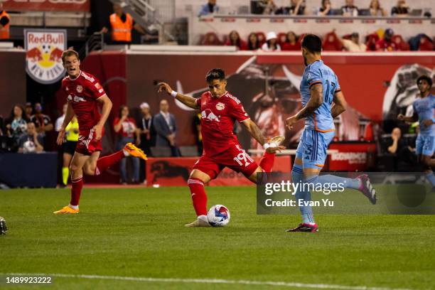 Wikelman Carmona of the New York Red Bulls shoots the ball during the second half against New York City FC at Red Bull Arena on May 13, 2023 in...