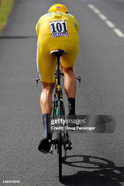 Bradley Wiggins of Great Britain riding for Sky Procycling races to first place in the individual time trial in stage nineteen and defends the race...