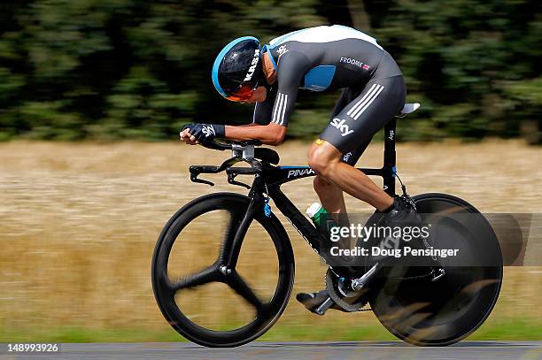 Christopher Froome of Great Britain riding for Sky Procycling races to second place in the individual time trial during stage nineteen as he defended...