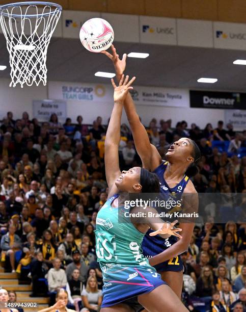 Kadie-Ann Dehaney of the Lightning and Mwai Kumwenda of the Vixens challenge for the ball during the round nine Super Netball match between Sunshine...