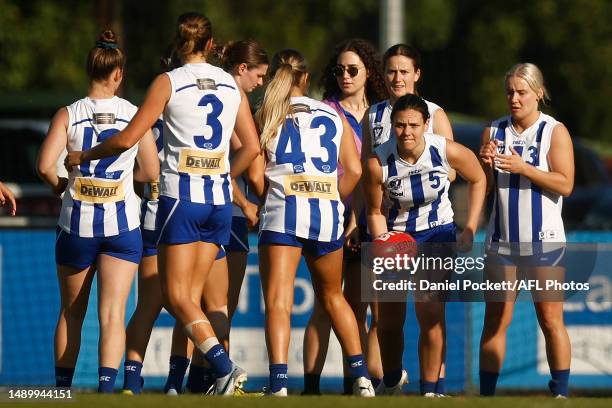 North Melbourne warm up before the round eight VFL match between Collingwood Magpies and North Melbourne Kangaroos at AIA Centre on May 14, 2023 in...