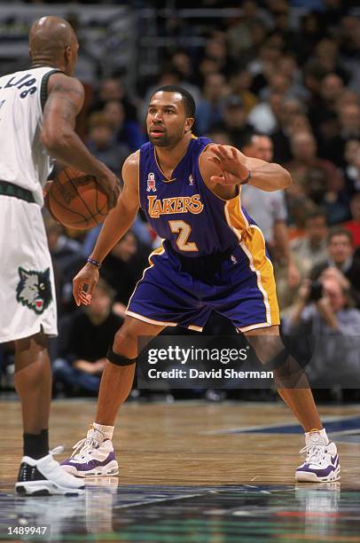 Point guard Derek Fisher of the Los Angeles Lakers plays defense during the NBA game against the Minnesota Timberwolves at the Target Center in...