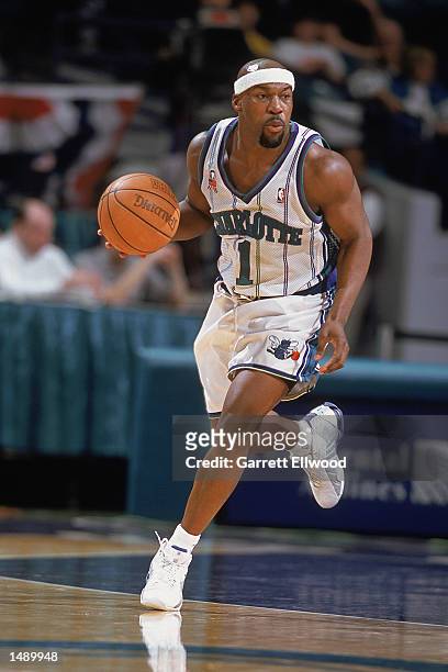 Point guard Baron Davis of the Charlotte Hornets dribbles the ball during the NBA game against the Los Angeles Clippers at Charlotte Colesium in...