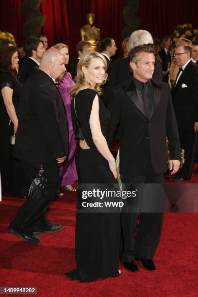 Robin Wright Penn and Sean Penn attend the 81st annual Academy Awards at the Kodak Theatre. Wright Penn wears Monique Lhuiller and Penn wears Giorgio...