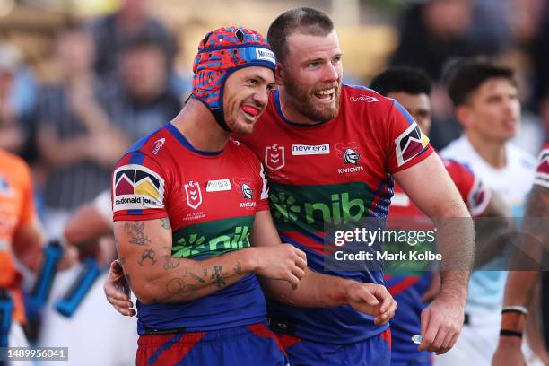 Kalyn Ponga and Lachlan Fitzgibbon of the Knights celebrate a try scored by Kalyn Ponga during the round 11 NRL match between Newcastle Knights and...