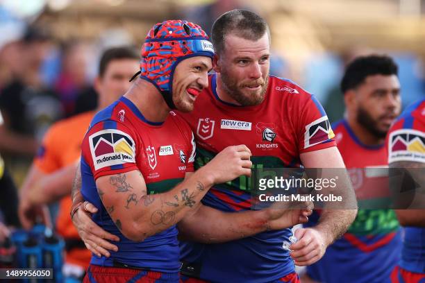 Kalyn Ponga and Lachlan Fitzgibbon of the Knights celebrate a try scored by Kalyn Ponga during the round 11 NRL match between Newcastle Knights and...
