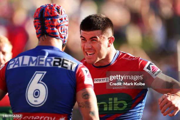 Kalyn Ponga and Bradman Best of the Knights celebrate a try scored by Bradman Best during the round 11 NRL match between Newcastle Knights and Gold...