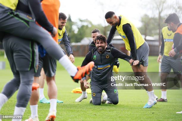 Pablo Sarabia, Diego Costa and Matheus Cunha of Wolverhampton Wanderers react during a Wolverhampton Wanderers Training Session at The Sir Jack...