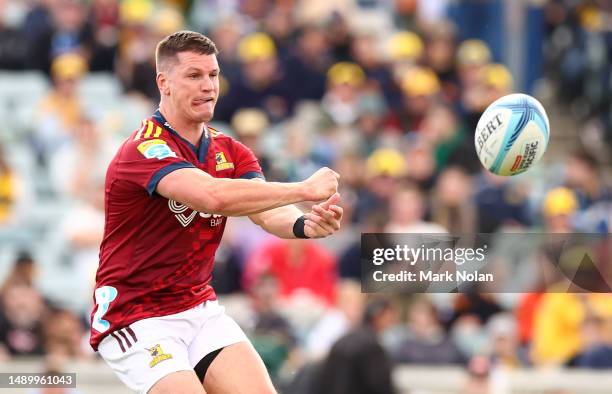 Freddie Burns of the Highlanders passes during the round 12 Super Rugby Pacific match between ACT Brumbies and Highlanders at GIO Stadium, on May 14...