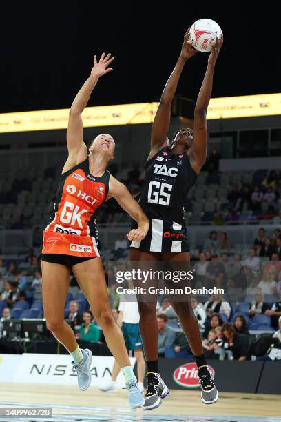 Shimona Nelson of the Magpies and Lauren Moore of the Giants competes for the ball during the round nine Super Netball match between Collingwood...