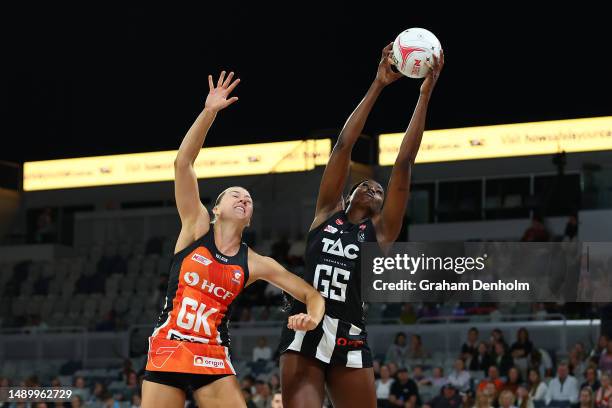 Shimona Nelson of the Magpies and Lauren Moore of the Giants competes for the ball during the round nine Super Netball match between Collingwood...