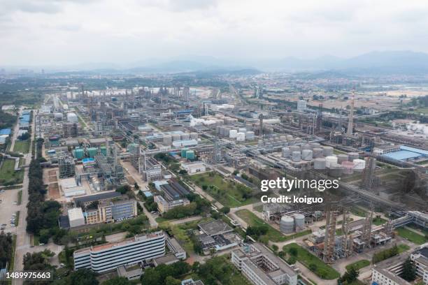 petrochemical plant in cloudy weather - industrial district stock pictures, royalty-free photos & images