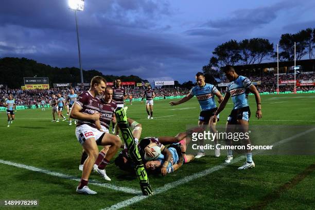 Nicholas Hynes of the Sharks is tackled short of the tryline during the round 11 NRL match between Manly Sea Eagles and Cronulla Sharks at 4 Pines...