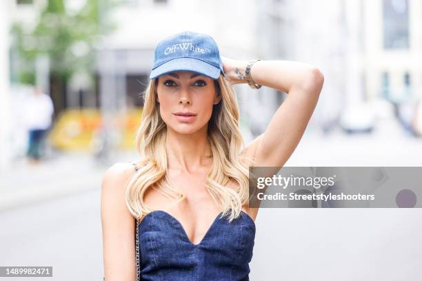 Model Annika Gassner, wearing a shoulder free Jenas Overall by Zara and a Jeans Cap by Off White, during a streetstyle shooting on September 1, 2022...