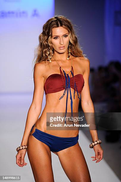 Model walks the runway during the Vitamin A By Amahlia Stevens fashion show at The Raleigh on July 20, 2012 in Miami, Florida.