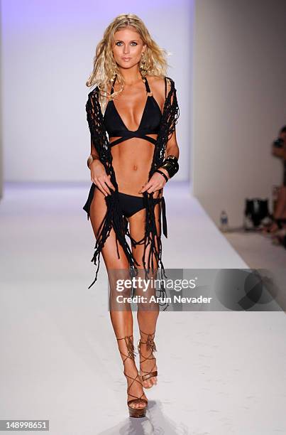 Model walks the runway during the Vitamin A By Amahlia Stevens fashion show at The Raleigh on July 20, 2012 in Miami, Florida.