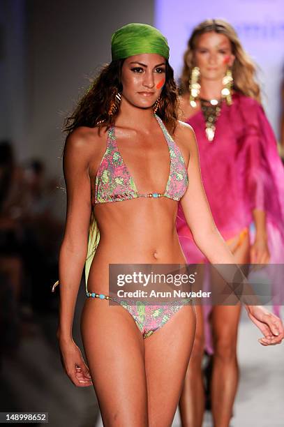 Model walks the runway during the Vitamin A By Amahlia Stevens fashion show at The Raleigh on July 20, 2012 in Miami, Florida.