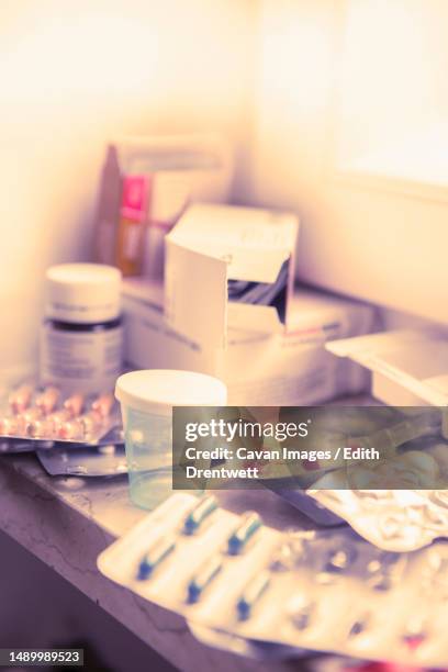 close-up of stacks of different pills in packets - vitamin sachet stock pictures, royalty-free photos & images
