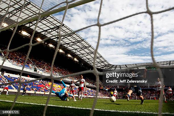 Antoine Hoppenot of the Philadelphia Union shoots on Bill Gaudette of the New York Red Bulls at Red Bull Arena on July 21, 2012 in Harrison, New...