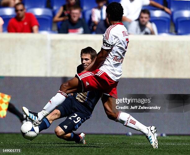 Antoine Hoppenot of the Philadelphia Union tries to get by Roy Miller of the New York Red Bulls at Red Bull Arena on July 21, 2012 in Harrison, New...