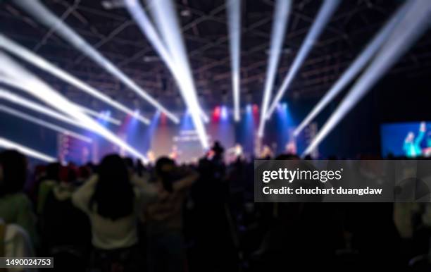 defocused illuminated lights at stage a music concert - awards night show stock pictures, royalty-free photos & images