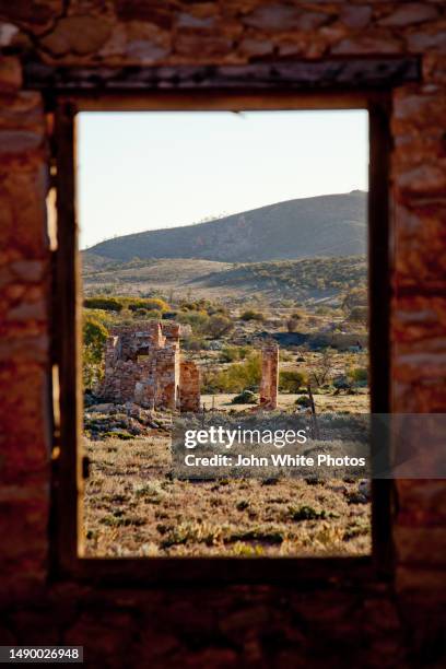 looking though a window at old stone ruins. flinders ranges. south australia. - flinders ranges stock-fotos und bilder