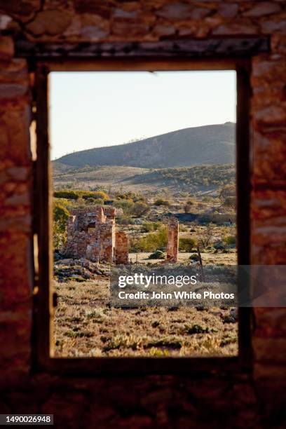 looking though a window at old stone ruins. flinders ranges. south australia. - flinders ranges stockfoto's en -beelden