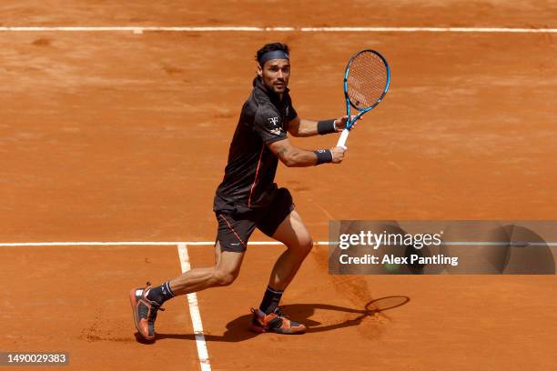 Fabio Fognini of Italy plays a backhand shot during the Men's Singles Round of 32 match against Holger Rune of Denmark during Day Seven of the...