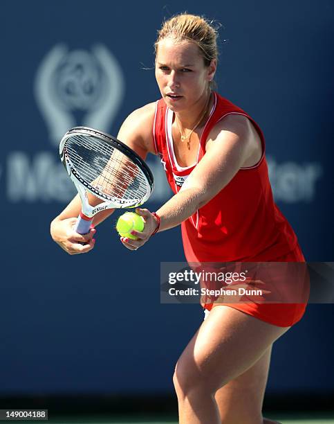 Dominka Cibulkova of Slovakia serves to Nadia Petrova of Russia during day eight of the Mercury Insurance Open Presented By Tri-City Medical at La...