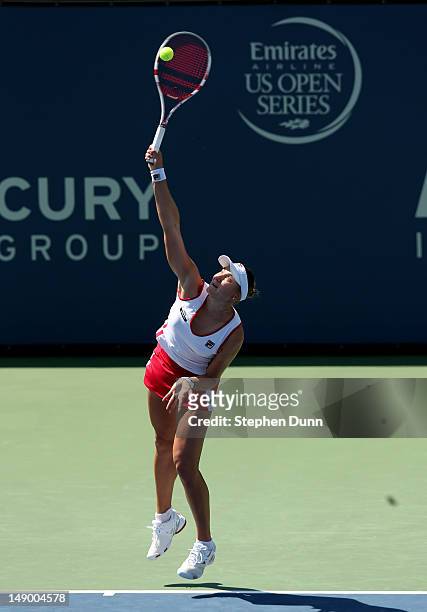 Nadia Petrova of Russia serves to Dominka Cibulkova of Slovakia in their semifinal match during day eight of the Mercury Insurance Open Presented By...