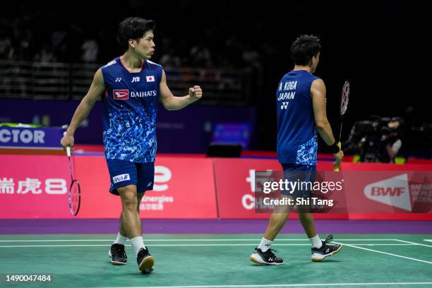 Akira Koga and Taichi Saito of Japan react in the Men's Doubles Round Robin match against Ben Lane and Sean Vendy of England during day one of the...
