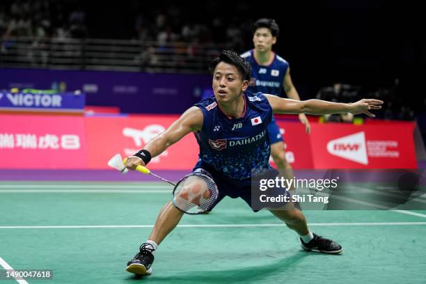 Akira Koga and Taichi Saito of Japan compete in the Men's Doubles Round Robin match against Ben Lane and Sean Vendy of England during day one of the...