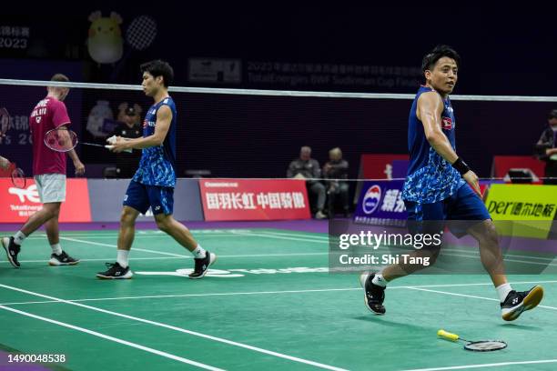 Akira Koga and Taichi Saito of Japan celebrate the victory in the Men's Doubles Round Robin match against Ben Lane and Sean Vendy of England during...