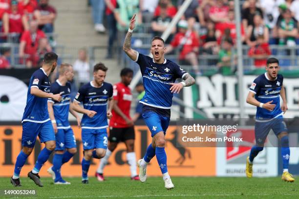 Philip Tietz of SV Darmstadt 98 celebrates after scoring the team's first goal during the Second Bundesliga match between Hannover 96 and SV...