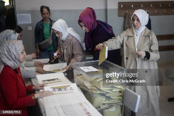 Woman casts her vote during Turkey's general election on May 14, 2023 in Istanbul, Turkey. Today, President Recep Tayyip Erdogan faces his biggest...