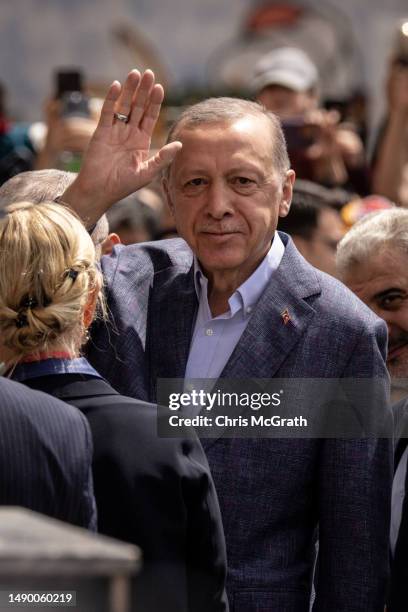 Turkey's President Recep Tayyip Erdogan waves as he arrives to cast his vote during Turkey's general election on May 14, 2023 in Istanbul, Turkey....