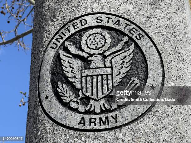 Army emblem on a circular surface with surrounding trees, sky visible in the background, Walnut Creek, California, April 18, 2023.