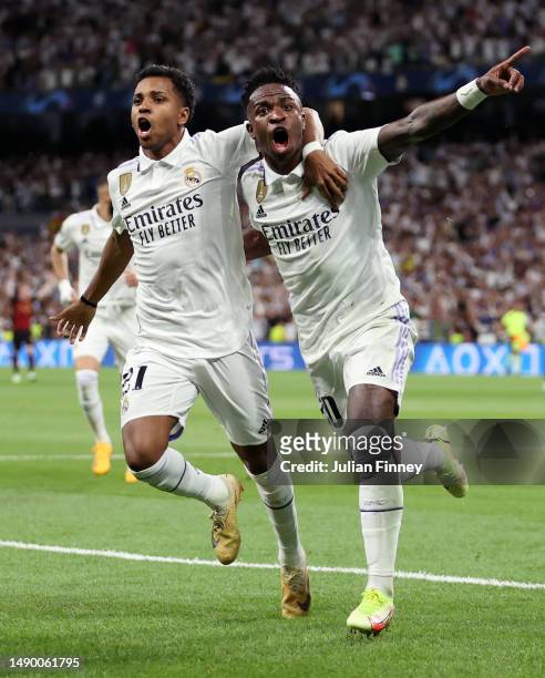 Vinicius Junior of Real Madrid celebrates after scoring the team's first goal with Rodrygo during the UEFA Champions League semi-final first leg...