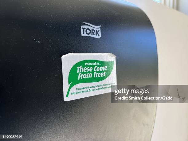 Paper towel dispenser with conservation sticker, text reading These Come From Trees, visible in Sausalito, California, April 27, 2023.