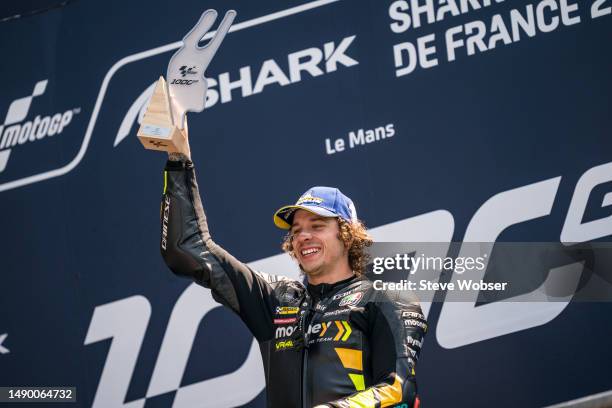 Marco Bezzecchi of Italy and Mooney VR46 Racing Team with his trophy on the podium after his race win during the Race of the MotoGP SHARK Grand Prix...