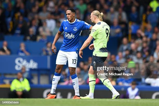 Yerry Mina of Everton clashes with Erling Haaland of Manchester City during the Premier League match between Everton FC and Manchester City at...