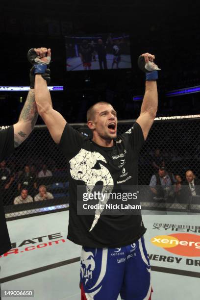 Anton Kuivanen celebrates after defeating Mitch Clarke after their lightweight bout at UFC 149 inside the Scotiabank Saddledome on July 21, 2012 in...