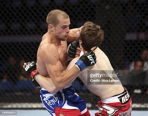 Anton Kuivanen attacks Mitch Clarke during their lightweight bout at UFC 149 inside the Scotiabank Saddledome on July 21, 2012 in Calgary, Alberta,...