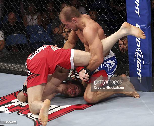 Mitch Clarke gets flipped by Anton Kuivanen during their lightweight bout at UFC 149 inside the Scotiabank Saddledome on July 21, 2012 in Calgary,...