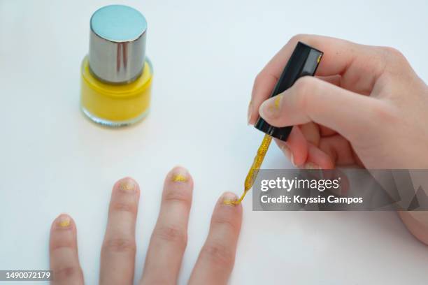 personal perspectiva of girl painting her nails  with nail polish at home - perspectiva personal bildbanksfoton och bilder