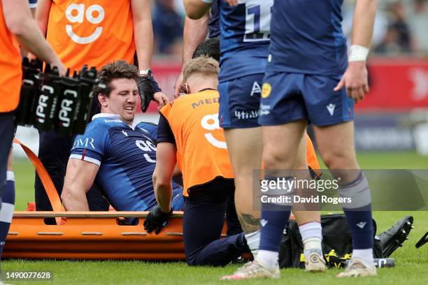 Ben Curry of Sale Sharks receives medical treatment, before being stretchered from the field, during the Gallagher Premiership Semi-Final match...