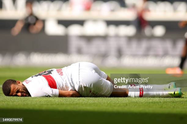 Josha Vagnoman of VfB Stuttgart goes down with an injury during the Bundesliga match between VfB Stuttgart and Bayer 04 Leverkusen at Mercedes-Benz...