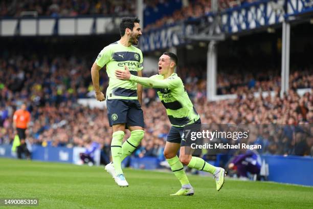 Ilkay Guendogan of Manchester City celebrates after scoring the team's third goal with Phil Foden during the Premier League match between Everton FC...