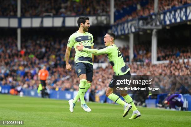 Ilkay Guendogan of Manchester City celebrates after scoring the team's third goal with Phil Foden during the Premier League match between Everton FC...